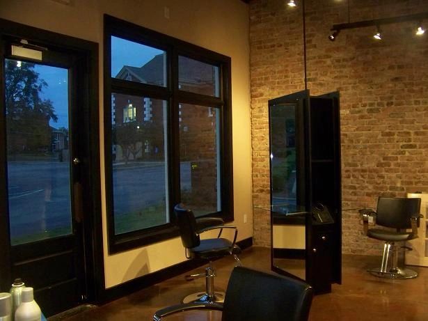 Interior of The Salon at Cumming Station with chairs and large windows